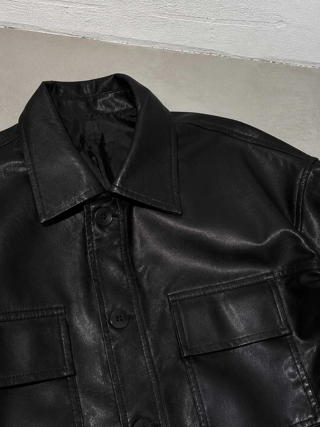 Code Culture catalog | korean-style-lapel-loose-temperament-leather-jacket | color-black | macro flat lay