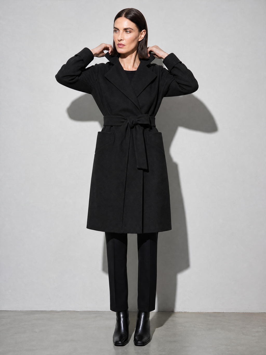 Women's Long Sleeve Woolen Coat in Black - adjusting view